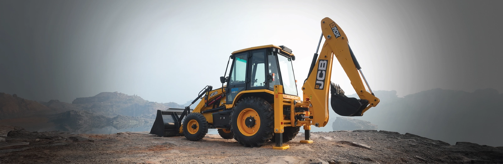 JCB backhoe loader operating at site